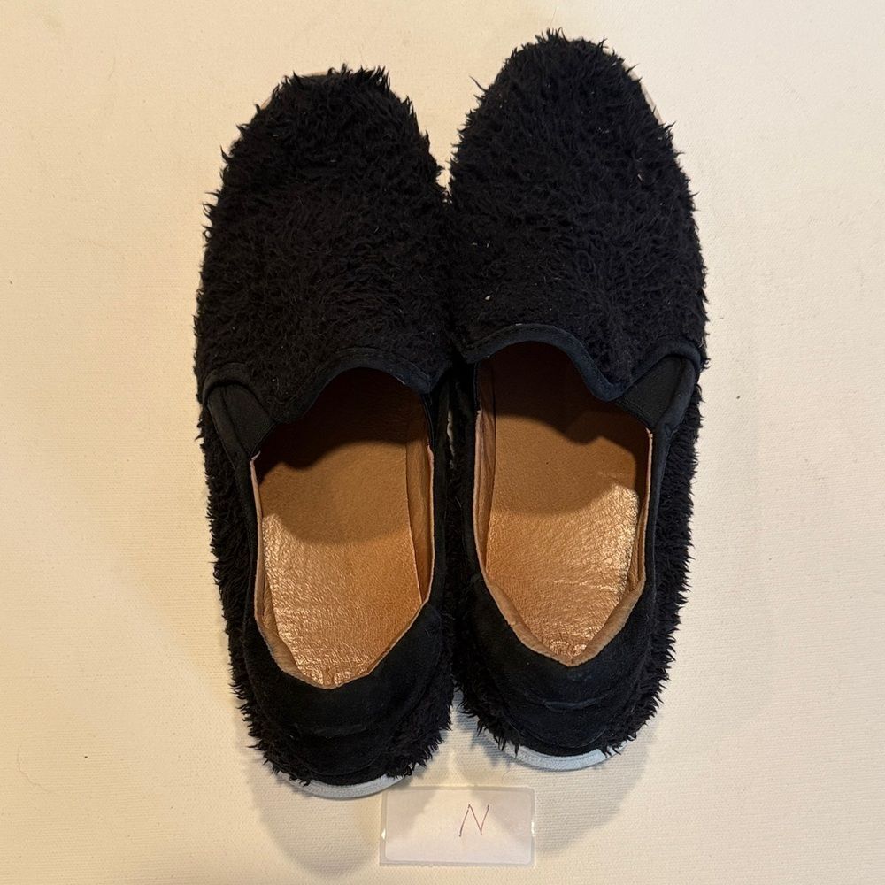 UGG Black Fuzzy Slip-On Sneakers with White Soles - Picture 3 of 3